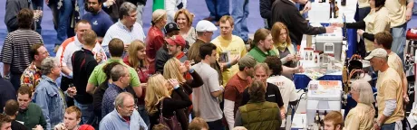 Crowd of people in the convention center.