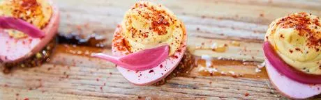 Deviled eggs with pickled onion.