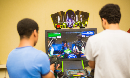 Attendees playing video games at Soda City Comic Con